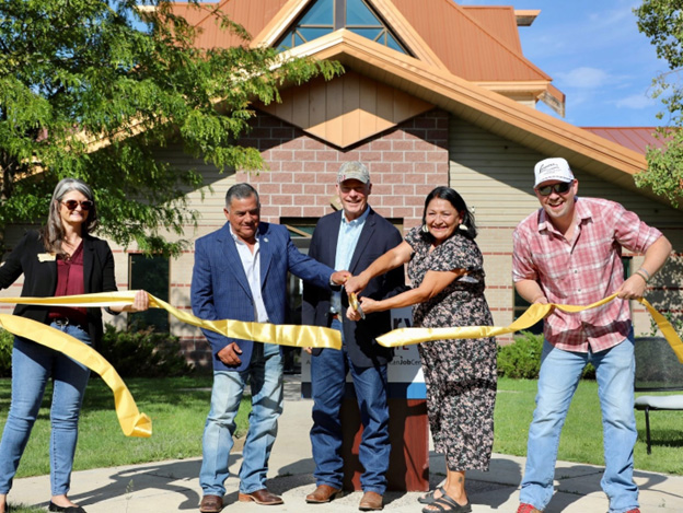 Commissioner Sarah Swanson, President Gene Small, Governor Greg Gianforte, Councilwoman Melissa Lonebear, Senator Gayle Lammers  cutting ribbon